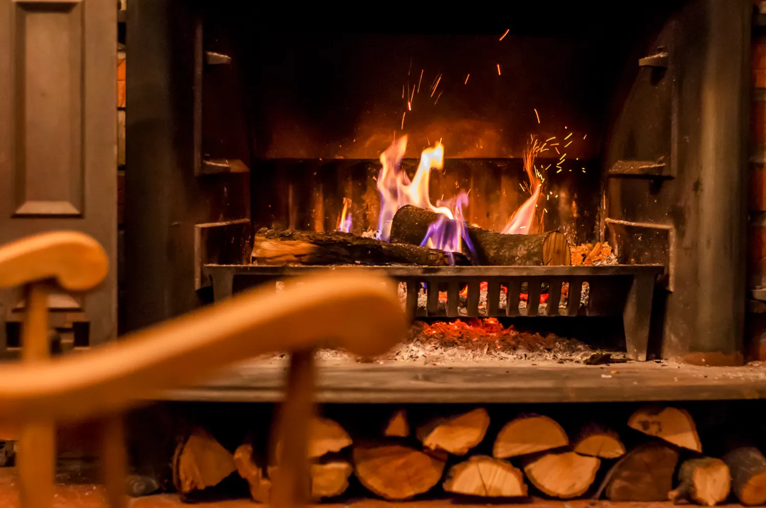 Open fireplace with burning logs