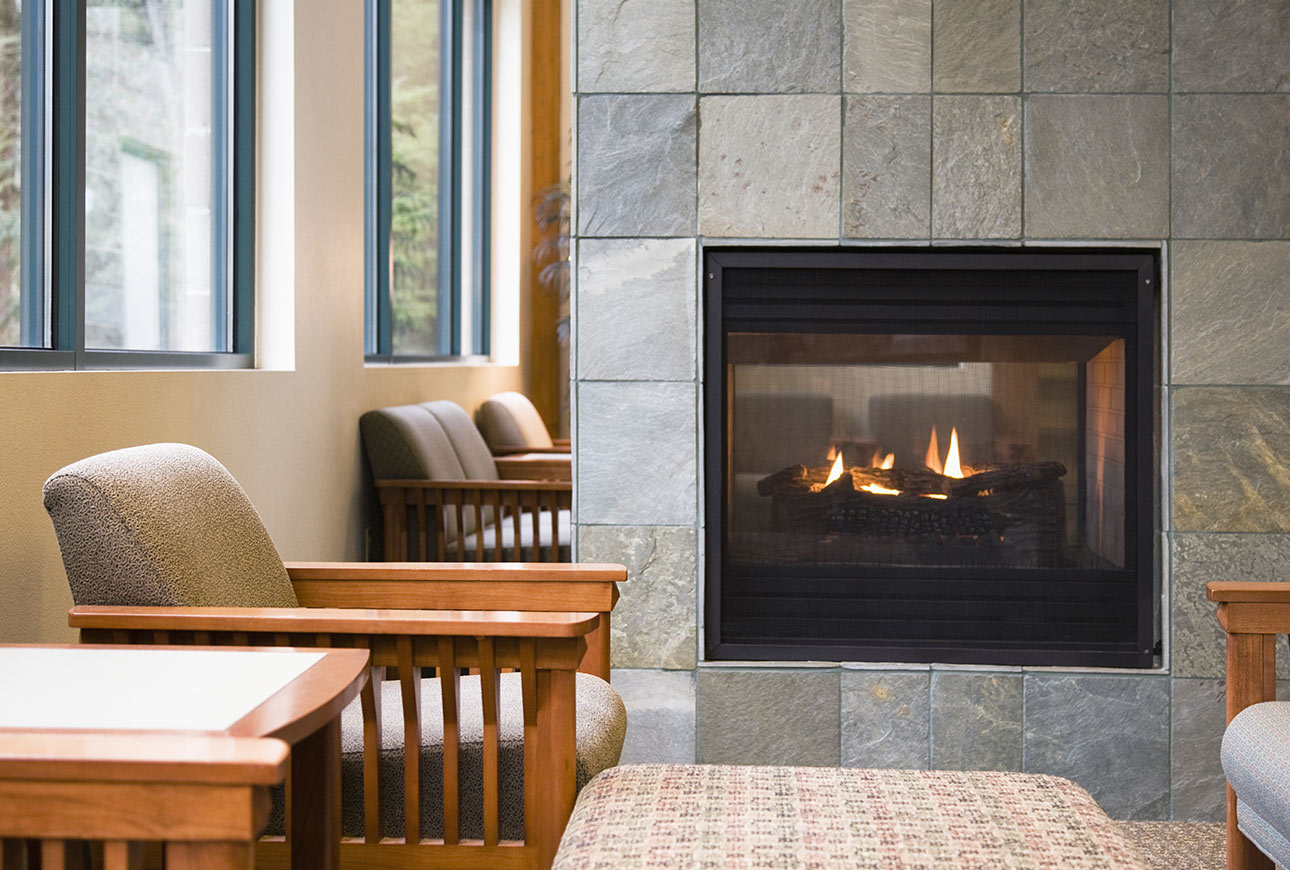 Modern fireplace with natural stone cladding